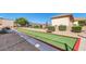 A community bocce ball court with manicured landscaping, benches and mountain views at 8212 E Masters Rd, Gold Canyon, AZ 85118