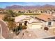 Single-story home with desert landscaping and mountain views at 8212 E Masters Rd, Gold Canyon, AZ 85118