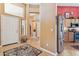 Warm foyer featuring tile flooring, a striking rug, and glimpses of an open floor plan, with a stainless steel refrigerator at 8212 E Masters Rd, Gold Canyon, AZ 85118