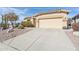 Single-story home with desert landscaping and attached two-car garage at 8212 E Masters Rd, Gold Canyon, AZ 85118