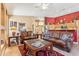 Inviting living room with leather sofas and a view into the kitchen at 8212 E Masters Rd, Gold Canyon, AZ 85118