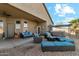 Outdoor patio featuring stylish furniture, a fire pit, and a hot tub at 906 E Beautiful Ln, Phoenix, AZ 85042