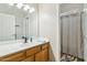 Well-lit bathroom with ample counter space and a shower at 906 E Beautiful Ln, Phoenix, AZ 85042