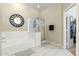 Clean bathroom with a soaking tub and a glass-enclosed shower at 906 E Beautiful Ln, Phoenix, AZ 85042