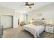 Inviting bedroom with soft carpet, ceiling fan, and tranquil decor at 906 E Beautiful Ln, Phoenix, AZ 85042