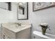 This bathroom includes a marble countertop vanity with a sink and decorative accents at 917 N Nina Dr, Mesa, AZ 85201