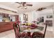 Eat-in kitchen showcasing a glass dining table with wrought iron chairs at 917 N Nina Dr, Mesa, AZ 85201