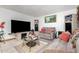 Comfortable living room showcasing tile flooring, neutral walls, and cozy seating at 917 N Nina Dr, Mesa, AZ 85201