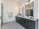 Modern bathroom with dual vanities, sleek black hardware, and a spacious glass-enclosed shower at 9230 E Cloudview Ave, Gold Canyon, AZ 85118