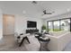 Cozy living room with large windows, comfortable seating, and a contemporary design at 9278 E Cloudview Ave, Gold Canyon, AZ 85118