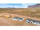 Aerial view of new homes under construction within a vibrant desert community, enhanced by the scenic mountain backdrop at 9362 E Cloudview Ave, Gold Canyon, AZ 85118