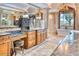 Opulent bathroom with dual vanities, marble countertops, freestanding tub, and chandelier at 9547 N 55Th St, Paradise Valley, AZ 85253