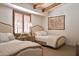 Bright bedroom with twin beds, window shutters, and decorative lamps and accents at 9547 N 55Th St, Paradise Valley, AZ 85253