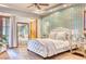 Chic bedroom featuring an accent wall, tufted headboard, and wood floors at 9547 N 55Th St, Paradise Valley, AZ 85253