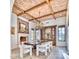 Dining room with a brick ceiling, fireplace, decorative lighting, and beautiful wood table at 9547 N 55Th St, Paradise Valley, AZ 85253