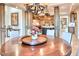 Elegant dining room showcasing a wood table, chandelier, and access to the gourmet kitchen with custom cabinets at 9547 N 55Th St, Paradise Valley, AZ 85253