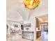 Arched foyer with travertine flooring, ornate chandelier and decorative furniture at 9547 N 55Th St, Paradise Valley, AZ 85253