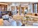 Comfortable living room showcases travertine floors, access to bar and kitchen, and designer furnishings at 9547 N 55Th St, Paradise Valley, AZ 85253