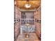 Custom wine cellar with brick flooring and plenty of wine storage at 9547 N 55Th St, Paradise Valley, AZ 85253