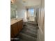 Inviting bathroom featuring a vanity, bathtub, and shower combination at 11821 W Yuma St, Avondale, AZ 85323