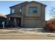 Two-story home featuring a covered porch, an attached two-car garage, and a combination of stucco and siding at 11821 W Yuma St, Avondale, AZ 85323