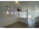 View of bright living room featuring wood-look tile flooring and many windows for ample lighting at 11821 W Yuma St, Avondale, AZ 85323