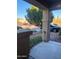 View from the porch with decorative landscaping elements and black metal railing at 11821 W Yuma St, Avondale, AZ 85323