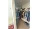 Walk-in closet with built-in shelving, hanging rods, and overhead storage at 11821 W Yuma St, Avondale, AZ 85323