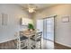 Bright dining area featuring hardwood floors and lots of natural light at 12766 W Dreyfus Dr, El Mirage, AZ 85335