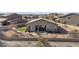 Aerial view of the backyard with a patio, firepit, and desert landscaping at 13121 S 178Th Ave, Goodyear, AZ 85338