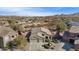 Stunning aerial view showcasing the home, three-car garage, and lush desert landscaping at 13121 S 178Th Ave, Goodyear, AZ 85338