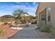 Desert backyard with dining, BBQ, firepit, desert plants, and patio swing at 13121 S 178Th Ave, Goodyear, AZ 85338