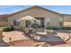 Back patio showcasing an outdoor seating area, fire pit, and stunning views at 13121 S 178Th Ave, Goodyear, AZ 85338