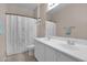 Bright bathroom with double sinks and shower-tub combination at 13121 S 178Th Ave, Goodyear, AZ 85338