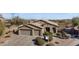 Inviting single-story home with manicured landscaping, a three-car garage, and a tile roof at 13121 S 178Th Ave, Goodyear, AZ 85338