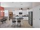 Bright kitchen with stainless steel appliances, island with seating and neutral tones at 13121 S 178Th Ave, Goodyear, AZ 85338