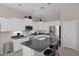 Kitchen featuring white cabinetry, black countertops, and stainless steel appliances at 13121 S 178Th Ave, Goodyear, AZ 85338