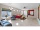 Bright and spacious living room with tile flooring, neutral walls, and lots of natural light at 13121 S 178Th Ave, Goodyear, AZ 85338