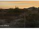 Sunset view looking over the desert landscape featuring cactus and mountains at 13121 S 178Th Ave, Goodyear, AZ 85338