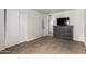 Neutral bedroom with closet and dresser with TV and doorway to the next room at 13204 N 3Rd Way, Phoenix, AZ 85022