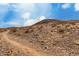 Views of the local desert landscape, featuring rocky ground and scrub brush at 13204 N 3Rd Way, Phoenix, AZ 85022