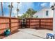 Enclosed patio featuring privacy fence and potted flowers on a decorative plant stand at 13204 N 3Rd Way, Phoenix, AZ 85022