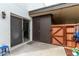 Enclosed patio with sliding glass door, gate to privacy fence, and exterior storage closet at 13204 N 3Rd Way, Phoenix, AZ 85022