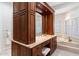 Bright bathroom with and vanity, granite countertop, and dark wood cabinets at 13670 N 85Th Pl, Scottsdale, AZ 85260