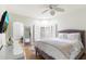 Bright bedroom features a bay window, plantation shutters, hardwood floors and luxury decor at 13670 N 85Th Pl, Scottsdale, AZ 85260