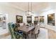 Elegant dining room with a modern chandelier and a stylish table perfect for entertaining guests at 13670 N 85Th Pl, Scottsdale, AZ 85260