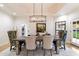 Elegant dining room with a modern chandelier and a stylish table perfect for entertaining guests at 13670 N 85Th Pl, Scottsdale, AZ 85260