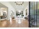 Grand foyer showcasing an open floor plan with views into the living and dining areas, featuring hardwood floors at 13670 N 85Th Pl, Scottsdale, AZ 85260