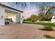 Exterior view showcasing the garage, extensive backyard, and a pool at 13670 N 85Th Pl, Scottsdale, AZ 85260