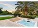 Inviting hot tub with mature greenery and a tennis court in the background at 13670 N 85Th Pl, Scottsdale, AZ 85260